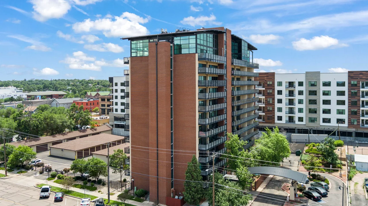Citywalk’s actual brick tower and glass penthouse crown at 417 East Kiowa Street