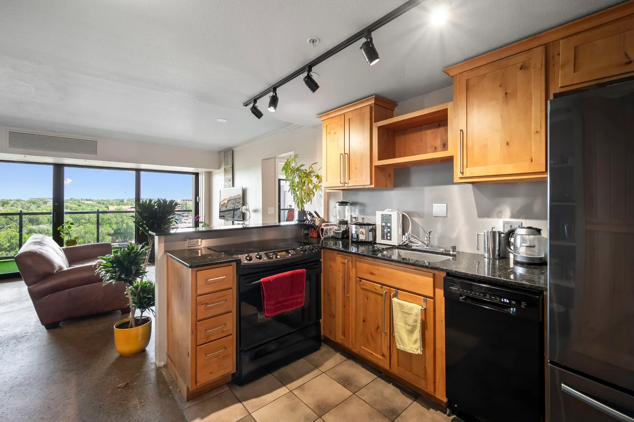 Kitchen and living area in actual Citywalk residence 1003
