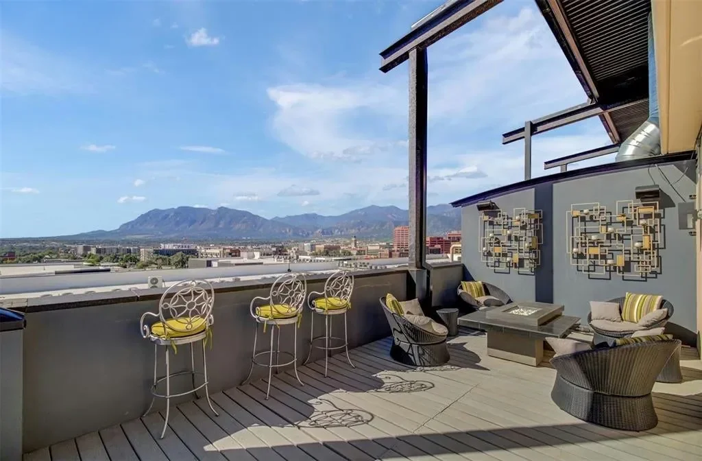 Private terrace of Citywalk penthouse 1201 with seating and a mountain outlook