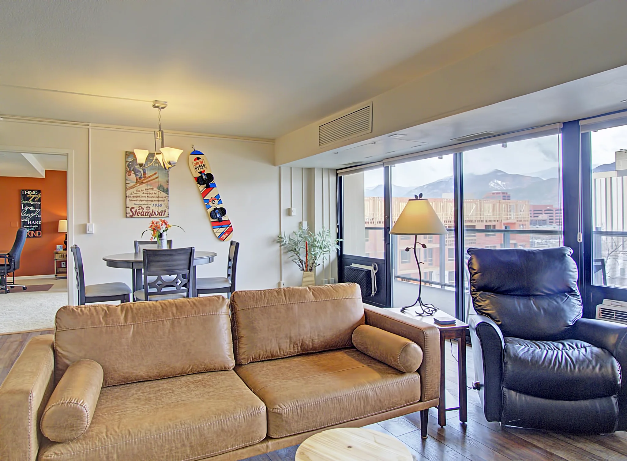 Living room in Citywalk residence 904 with balcony doors and a mountain outlook